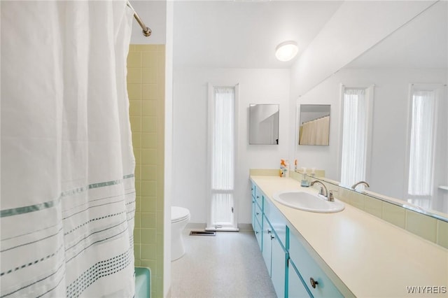 66 Stonecroft Ln, Amherst, NY 14226 - bathroom featuring vanity, healthy amount of natural light, toilet, and baseboards