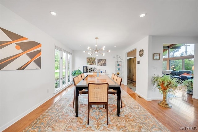 66 Stonecroft Ln, Amherst, NY 14226 - dining area with a chandelier, light wood-type flooring, recessed lighting, and baseboards