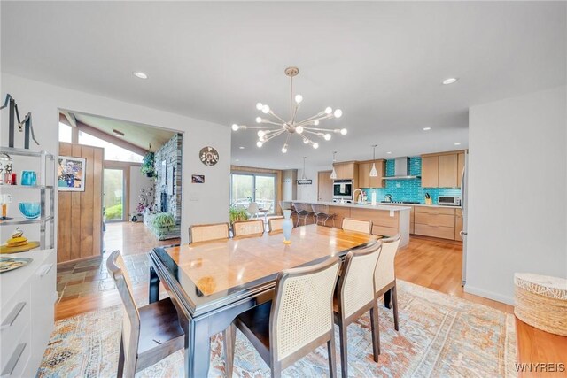 66 Stonecroft Ln, Amherst, NY 14226 - dining space featuring a chandelier, light wood finished floors, and recessed lighting