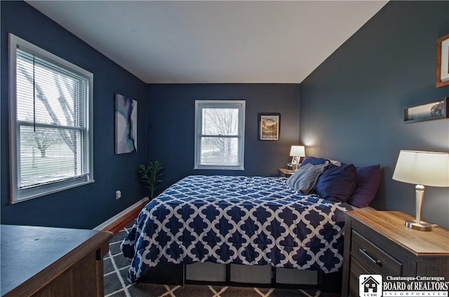 bedroom featuring baseboards