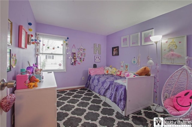 bedroom with carpet flooring and baseboards