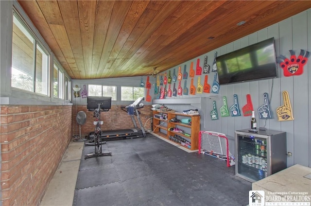 workout area with wooden ceiling and lofted ceiling