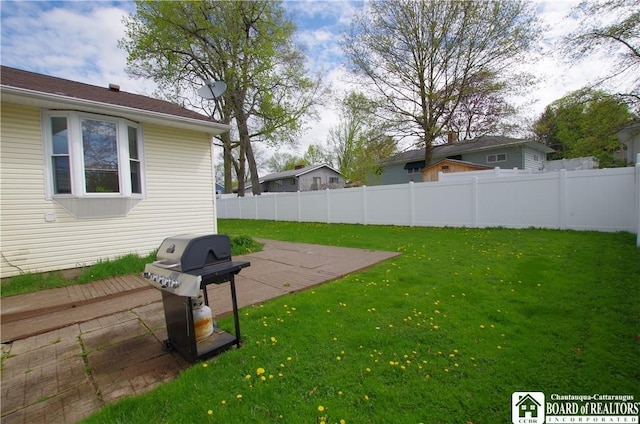 view of yard with a patio area and fence