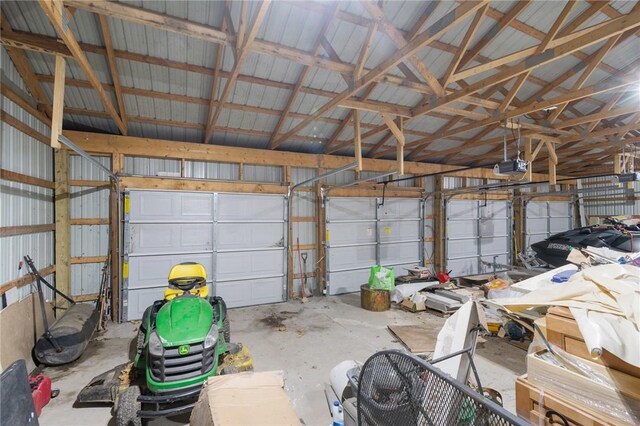 7893 Lake Rd, Sodus, NY 14555 - garage featuring metal wall and a garage door opener