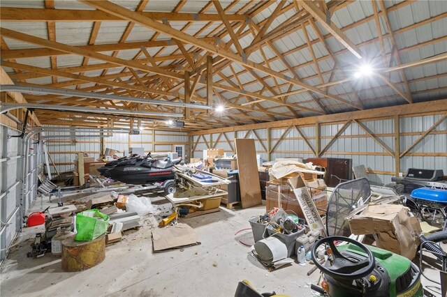 7893 Lake Rd, Sodus, NY 14555 - garage with a garage door opener and metal wall