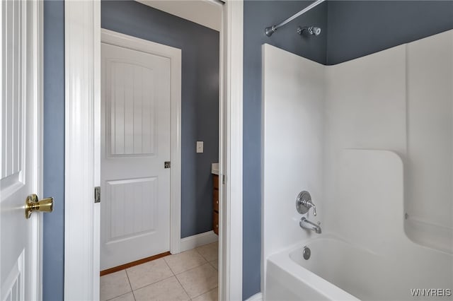 full bathroom featuring baseboards, tile patterned flooring, and shower / tub combination