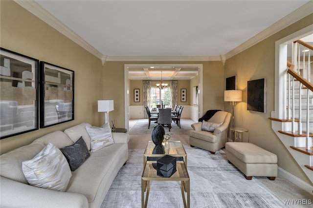 living room featuring stairs, light colored carpet, crown molding, a chandelier, and baseboards