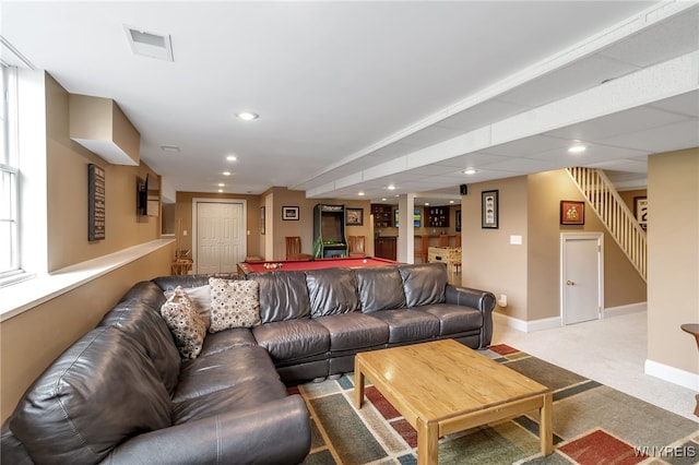 living room featuring stairs, pool table, light carpet, baseboards, and bar area