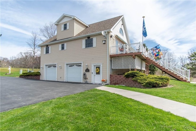 21770 Bullhead Bay Rd, Alexandria, NY 13640 - view of front of property with stairs, driveway, a garage, a front yard, and a deck
