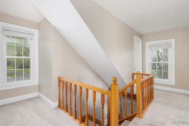 interior space with carpet flooring and baseboards