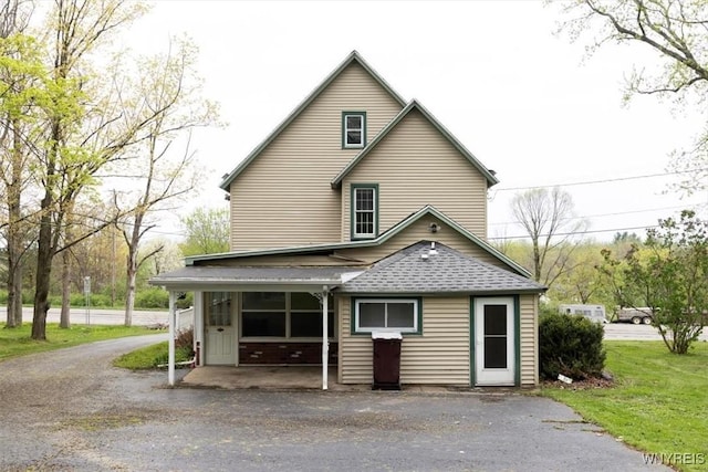 view of front of house with roof with shingles