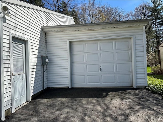 garage with aphalt driveway