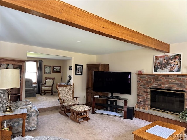 carpeted living room featuring a brick fireplace and beam ceiling