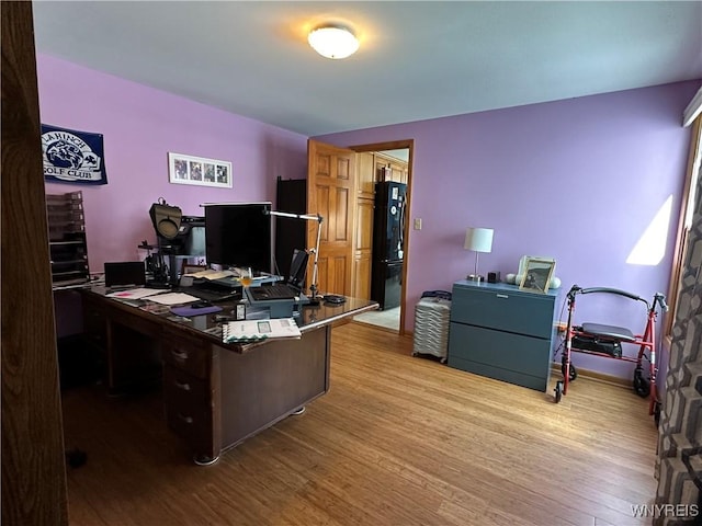 home office featuring wood finished floors