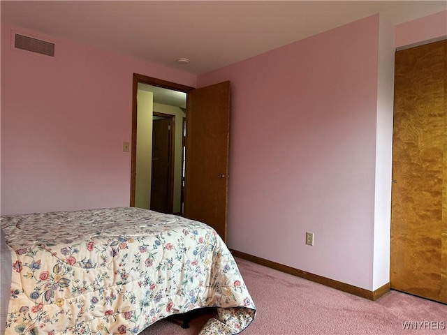bedroom featuring light carpet, baseboards, and visible vents