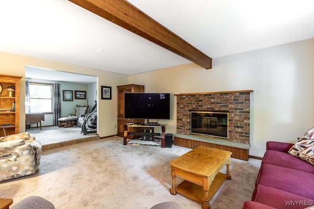 103 Old Orchard Ln, Orchard Park, NY 14127 - carpeted living room featuring a fireplace, beam ceiling, and baseboards