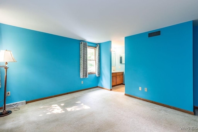 103 Old Orchard Ln, Orchard Park, NY 14127 - unfurnished bedroom featuring light carpet, baseboards, and connected bathroom
