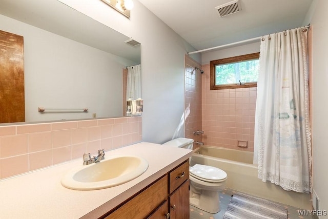 103 Old Orchard Ln, Orchard Park, NY 14127 - bathroom featuring toilet, vanity, shower / tub combo, and decorative backsplash