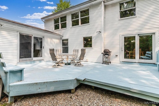 103 Old Orchard Ln, Orchard Park, NY 14127 - wooden deck with outdoor dining space and a grill