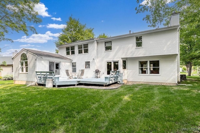 103 Old Orchard Ln, Orchard Park, NY 14127 - back of house featuring a wooden deck, a chimney, and a yard