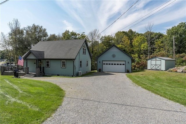 44458 County Route 100, Alexandria, NY 13640 - single story home with roof with shingles, an outdoor structure, a garage, and a front lawn