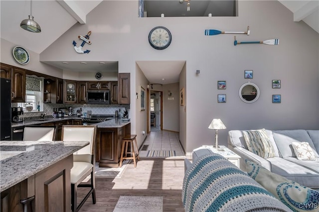 44458 County Route 100, Alexandria, NY 13640 - interior space featuring light wood finished floors, high vaulted ceiling, and visible vents