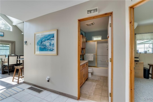 44458 County Route 100, Alexandria, NY 13640 - hall featuring vaulted ceiling, baseboards, light tile patterned floors, and visible vents
