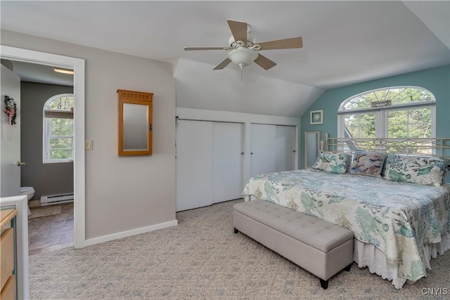 44458 County Route 100, Alexandria, NY 13640 - carpeted bedroom featuring vaulted ceiling, a baseboard radiator, ceiling fan, two closets, and baseboards