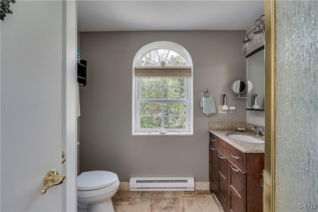 44458 County Route 100, Alexandria, NY 13640 - bathroom featuring a baseboard radiator, toilet, baseboards, and vanity