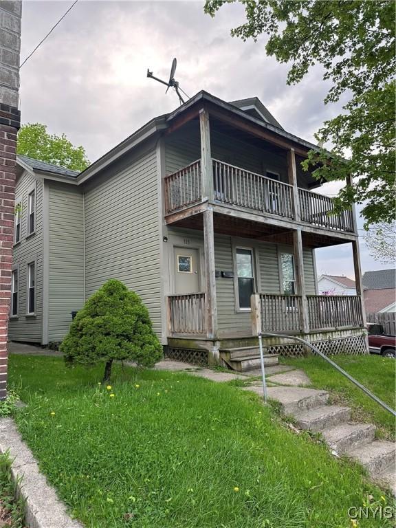 113 Grumbach Ave, Syracuse, NY 13203 - view of front of property featuring a balcony, a porch, and a front lawn