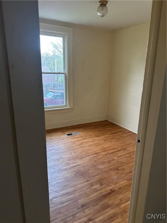 113 Grumbach Ave, Syracuse, NY 13203 - empty room featuring visible vents, wood finished floors, and baseboards
