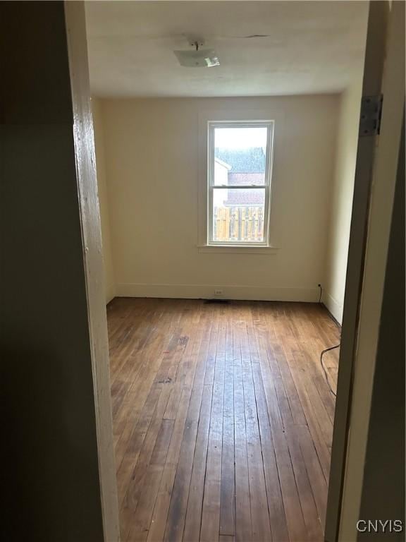 113 Grumbach Ave, Syracuse, NY 13203 - unfurnished room with baseboards and hardwood / wood-style flooring