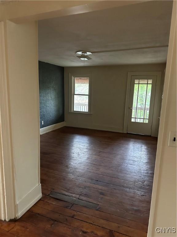 113 Grumbach Ave, Syracuse, NY 13203 - unfurnished room featuring baseboards, dark wood-style flooring, and a wealth of natural light