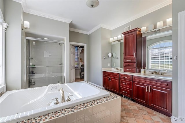 full bathroom featuring a sink, ornamental molding, a shower stall, double vanity, and a bath