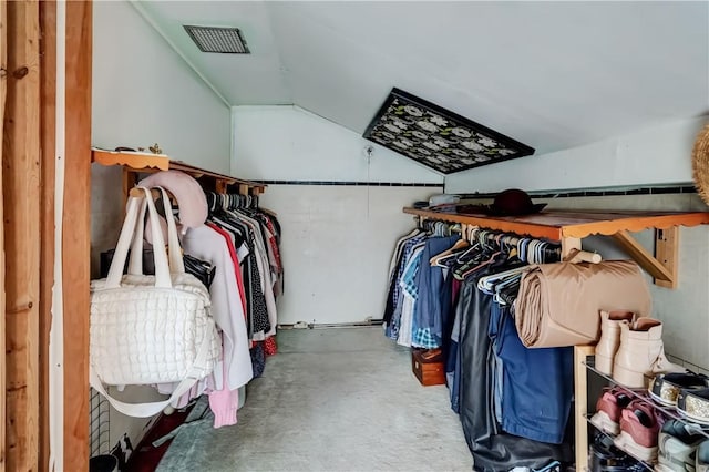 spacious closet with lofted ceiling and visible vents