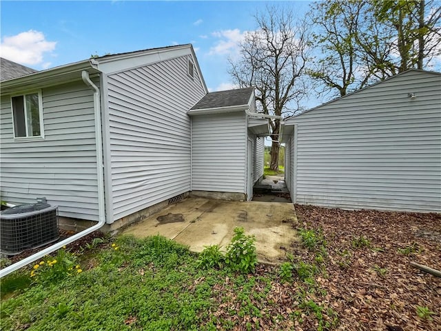 131 W Sullivanville Rd, Veteran, NY 14845 - view of property exterior with roof with shingles, cooling unit, and a patio