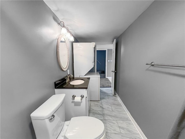 131 W Sullivanville Rd, Veteran, NY 14845 - half bathroom with marble look tiles, toilet, baseboards, and vanity
