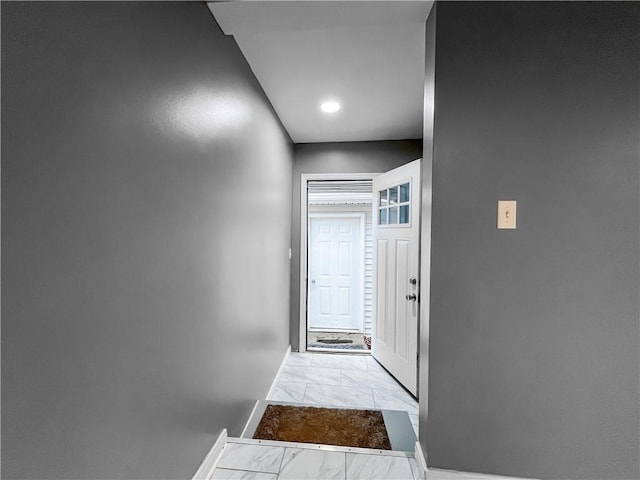 131 W Sullivanville Rd, Veteran, NY 14845 - hallway featuring light marble finish floors and baseboards