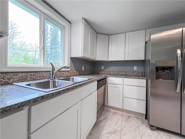 131 W Sullivanville Rd, Veteran, NY 14845 - kitchen with appliances with stainless steel finishes, a sink, light marble finish flooring, and white cabinets