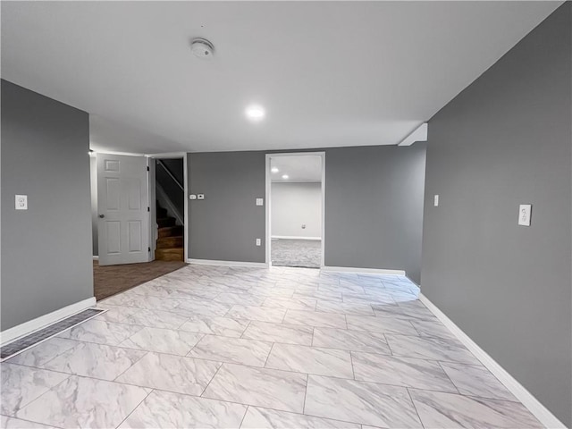 131 W Sullivanville Rd, Veteran, NY 14845 - finished below grade area featuring stairway, light marble finish floors, baseboards, and recessed lighting