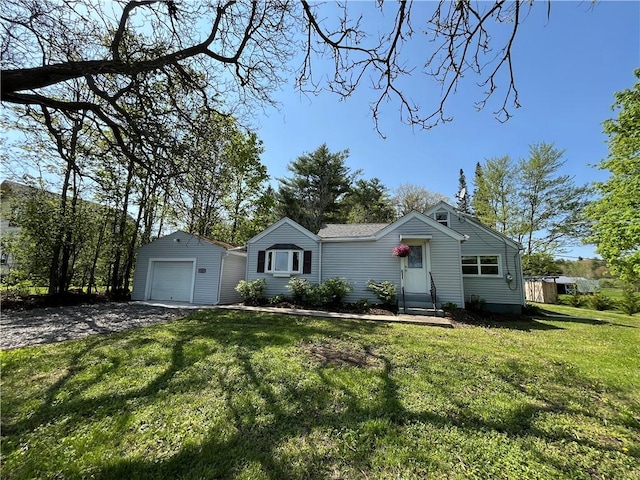 131 W Sullivanville Rd, Veteran, NY 14845 - view of front of home with entry steps, an outbuilding, a front lawn, driveway, and a detached garage
