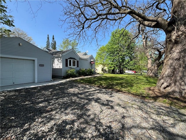 131 W Sullivanville Rd, Veteran, NY 14845 - view of side of home featuring a garage and a yard