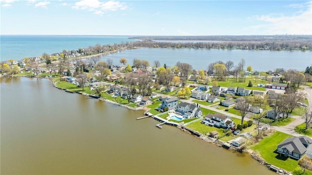 birds eye view of property featuring a water view and a residential view