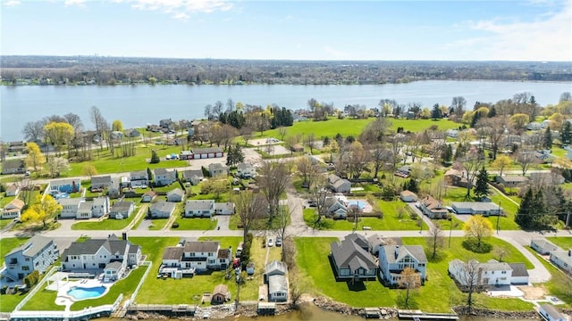 bird's eye view with a water view and a residential view