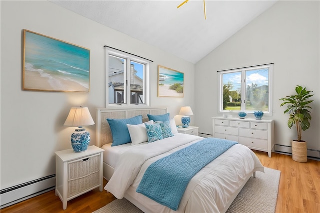 bedroom featuring a baseboard heating unit, a baseboard radiator, light wood finished floors, and vaulted ceiling