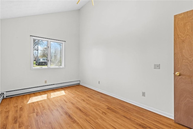 empty room featuring a baseboard radiator, baseboards, high vaulted ceiling, and wood finished floors