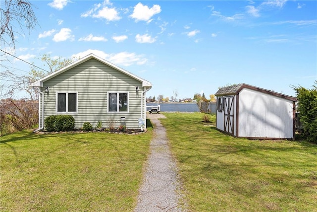 view of property exterior with a lawn, a shed, and an outdoor structure