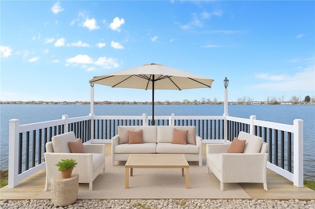 view of patio featuring a water view and outdoor lounge area