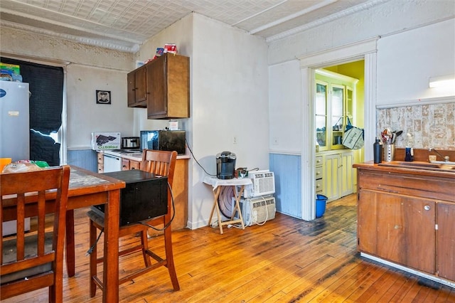 kitchen featuring light wood-style floors and a sink