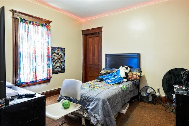 bedroom featuring baseboards